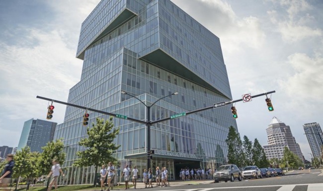 Find your perfect fit at University Village at Charlotte a large glass building with Fountain Place in the background