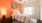 bedroom with orange ascent wall