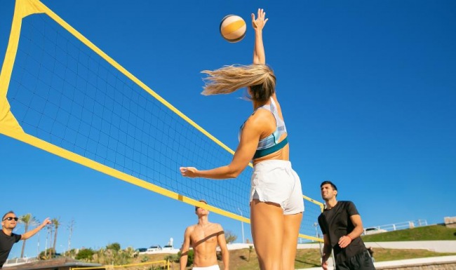 The essence of exceptional living a person jumping to hit a volleyball